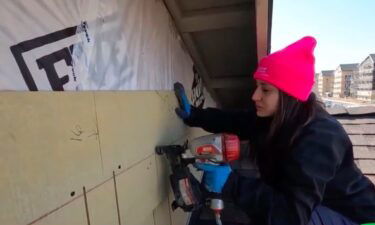 Women painted and learned to use nail guns to build their new homes on Le Donne Drive in south Sacramento on Saturday.