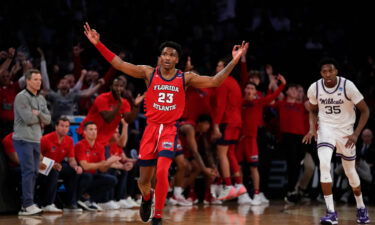 Florida Atlantic's Brandon Weatherspoon #23 celebrates a three-point basket in the second half against Kansas State.