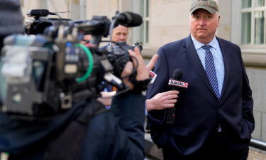 Former Ohio state House Speaker Larry Householder is surrounded by reporters outside the Potter Stewart US Courthouse in downtown Cincinnati on March 9 after a jury found him guilty of racketeering conspiracy.