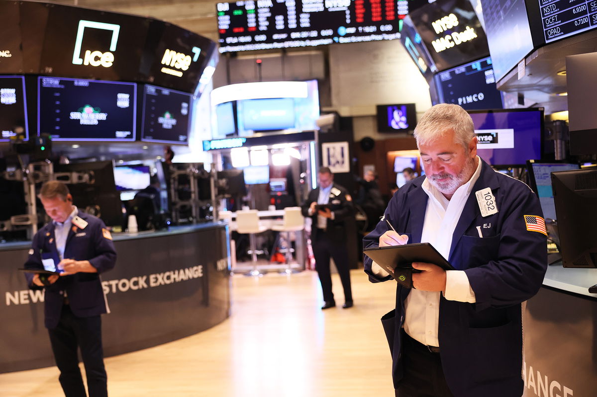 <i>Michael M. Santiago/Getty Images</i><br/>Traders work on the floor of the New York Stock Exchange during morning trading on February 22 in New York City.  Fear overtook Wall Street Thursday after SVB Financial Group told investors it had to sell $1.75 billion in shares at a loss.