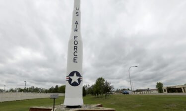 File photo showing a retired Minuteman 1 missile stands at the main entrance to Minot Air Force Base
