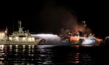 The Philippine Coast Guard responds to the fire aboard a passenger ferry in waters off Baluk-Baluk Island
