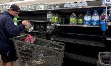 A customer shops for bottled water Sunday