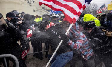 Trump supporters clash with police and security forces as people try to storm the US Capitol on January 6