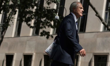 Former Trump White House trade adviser Peter Navarro arrives at a district court for a motion hearing in August 2022 in Washington