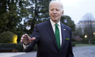 President Joe Biden waves as he walks to Marine One upon departure from the South Lawn of the White House on March 17.