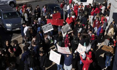 Students from East High School and West High School enter the Colorado State capitol to call for gun control measures on Thursday