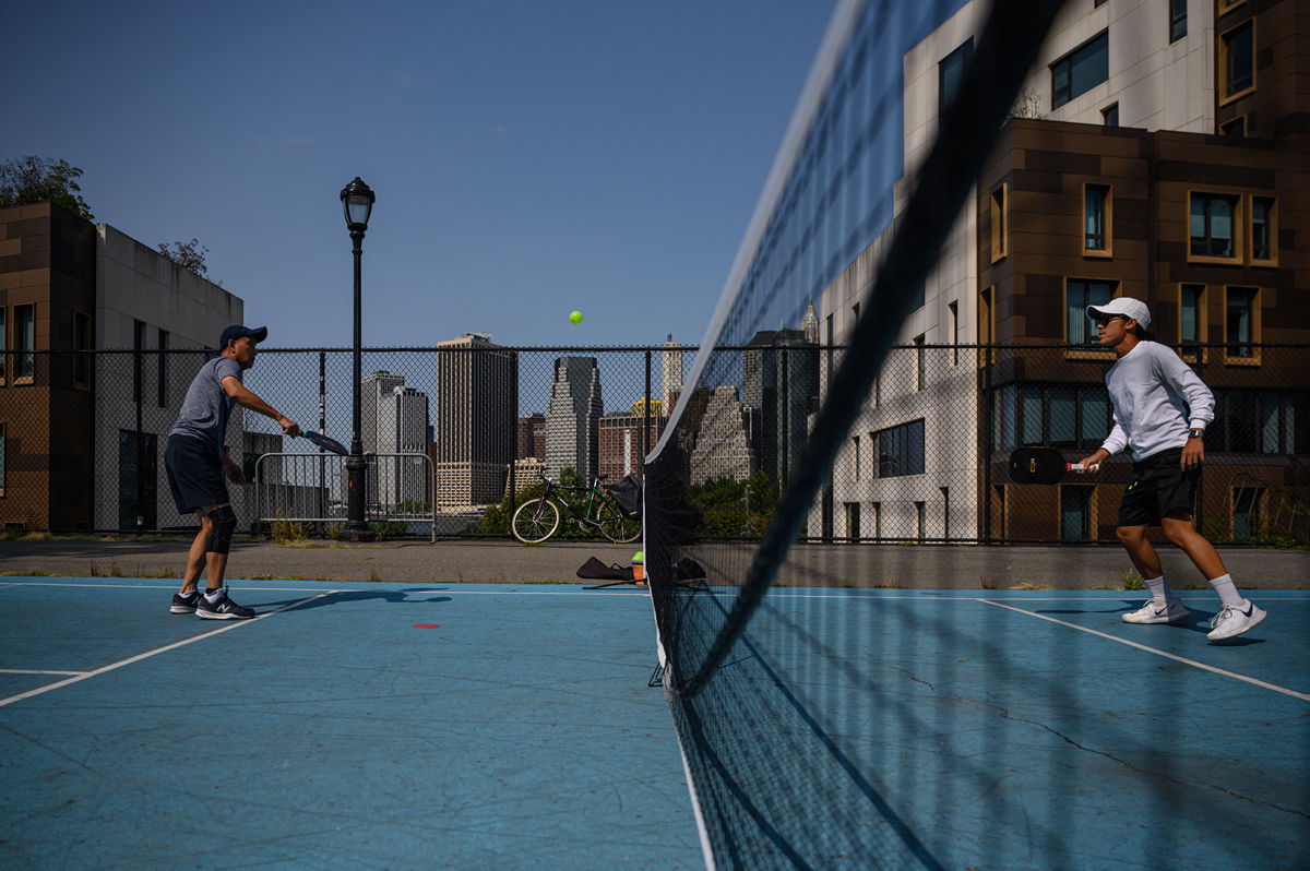 <i>Ed Jones/AFP/Getty Images</i><br/>People play pickleball at a public court in Brooklyn