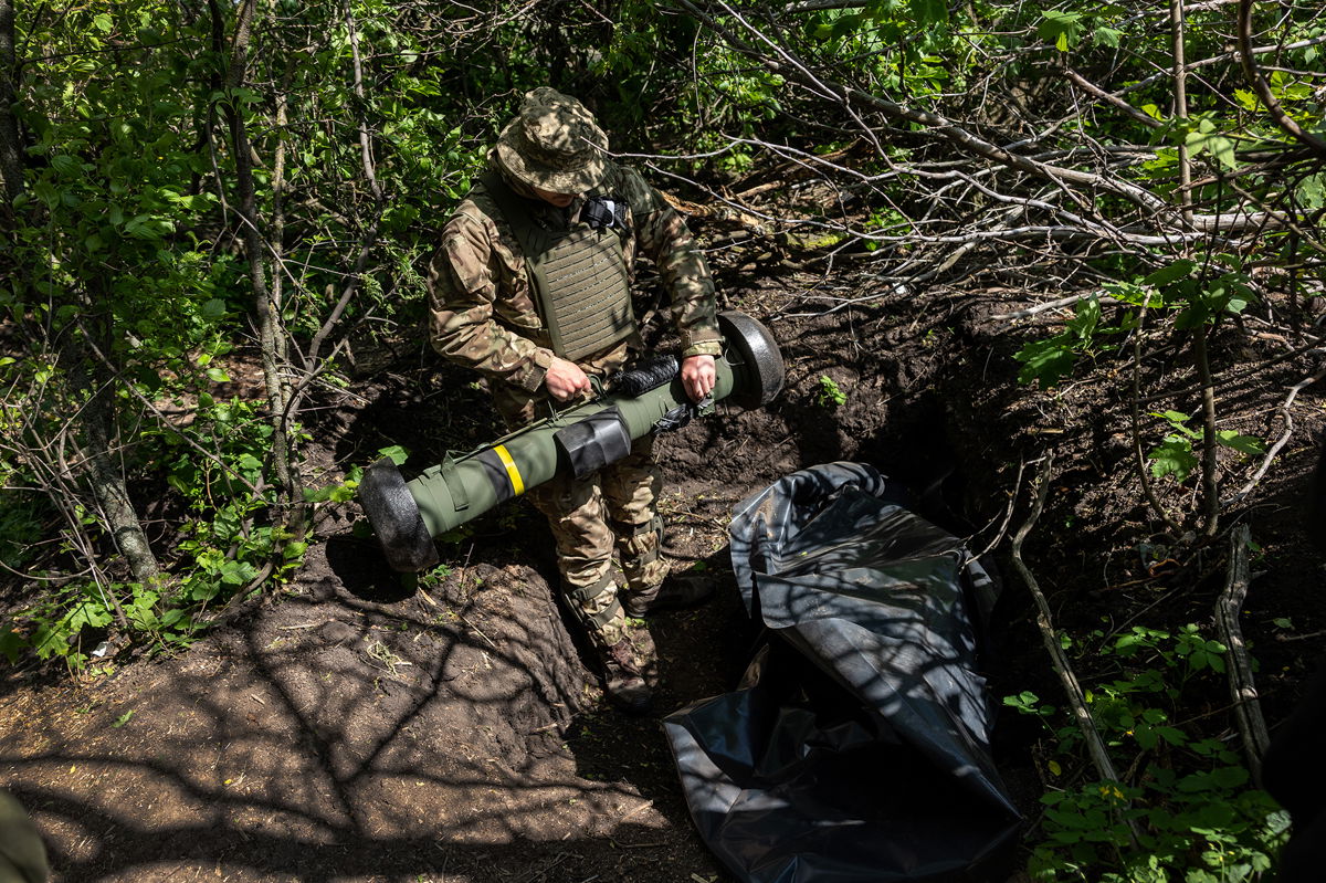 <i>John Moore/Getty Images</i><br/>A Ukrainian Army soldier places a US-made Javelin missile in a fighting position on the frontline on May 20