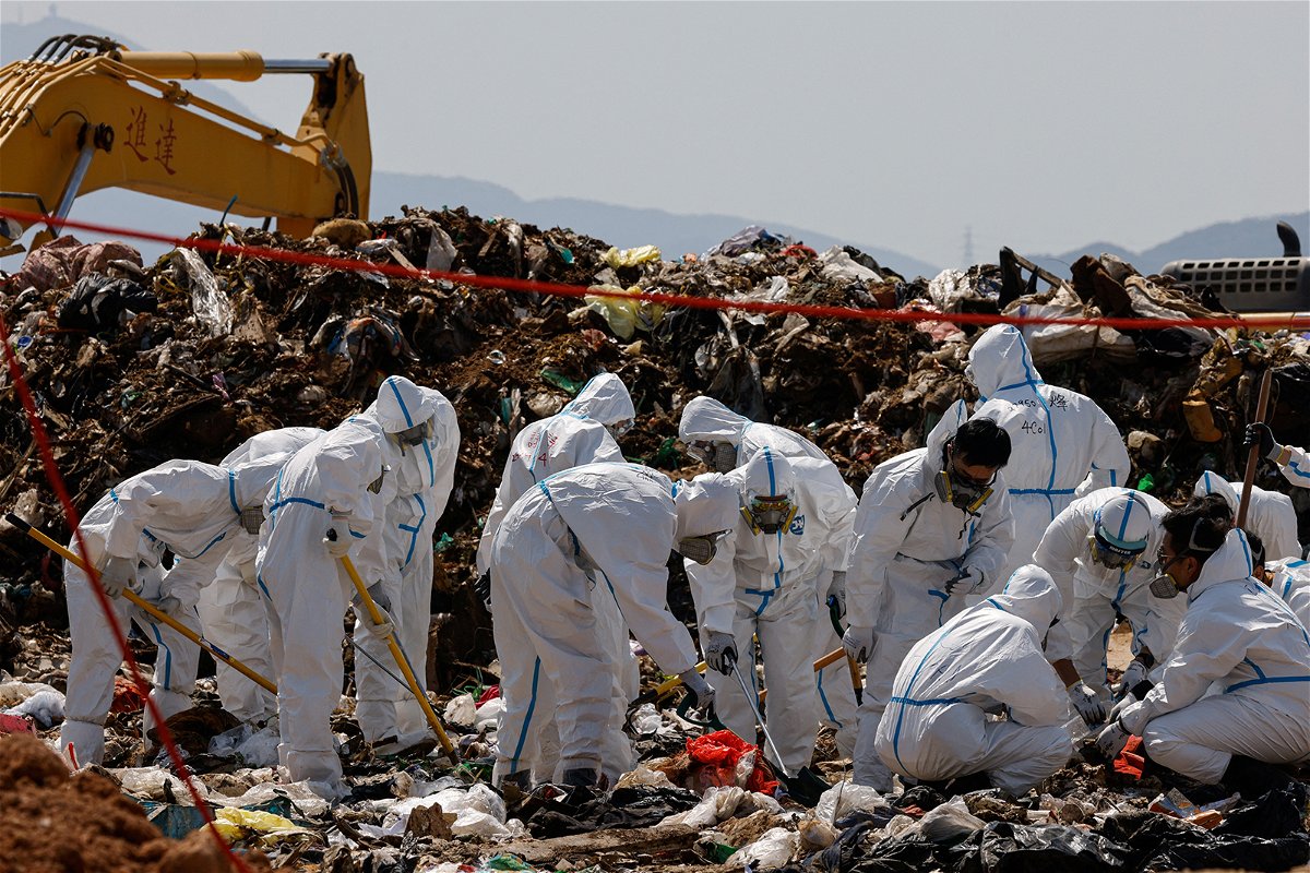 <i>Tyrone Siu/Reuters</i><br/>Police excavate a landfill during a search for the body parts of 28-year-old Abby Choi in Hong Kong on February 28.