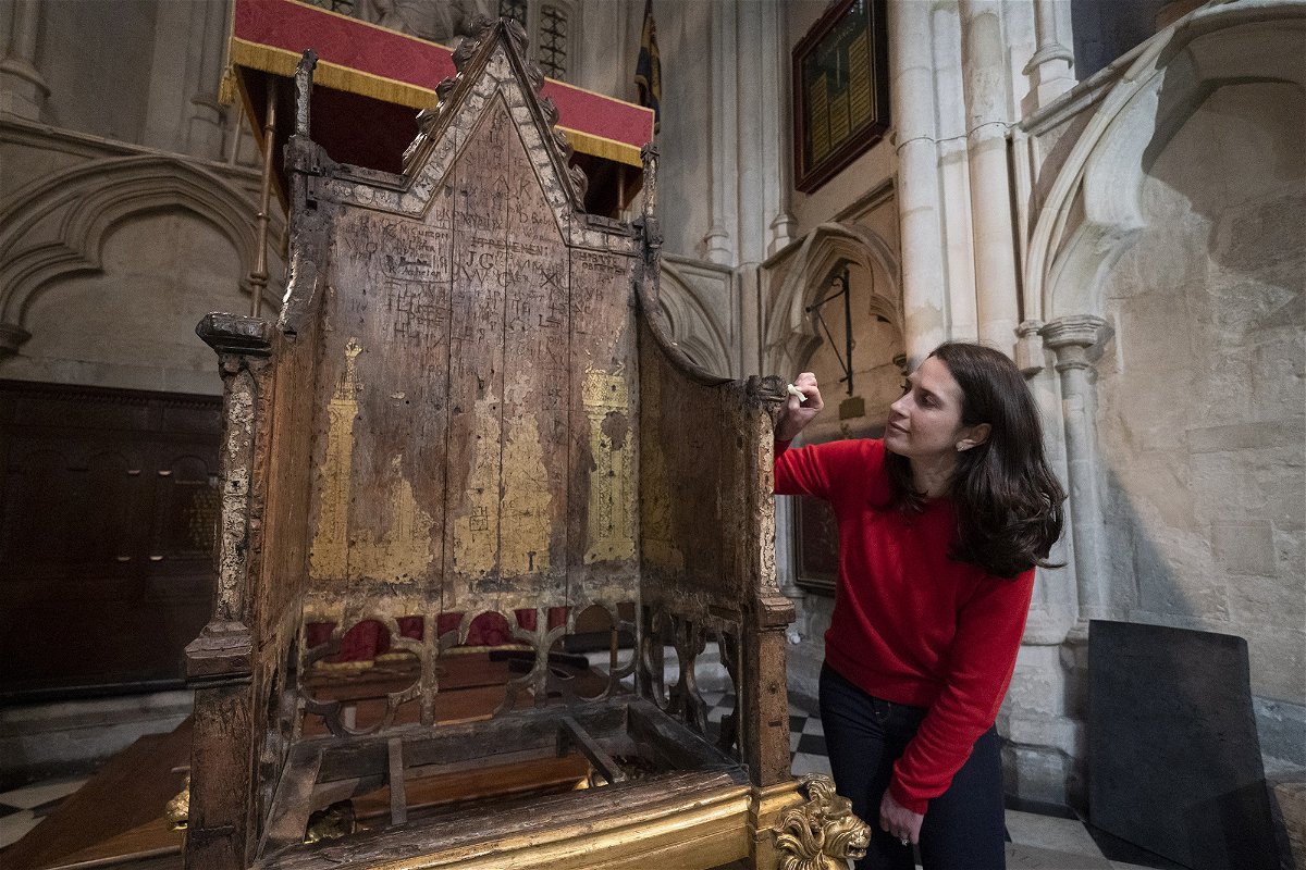 <i>Kirsty O'Connor/PA Images/Getty Images</i><br/>Conservator Krista Blessley works on the restoration of the 700-year-old chair