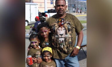 Joseph Fetcher is shown with his children