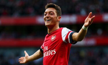 Özil celebrates scoring for Arsenal against Norwich City in 2013.