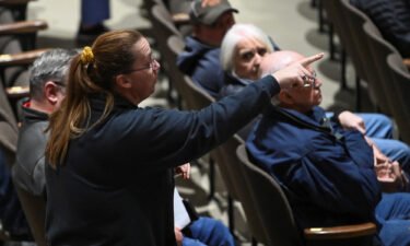 A woman points her finger during a town hall held by the U.S. Environmental Protection Agency (EPA)