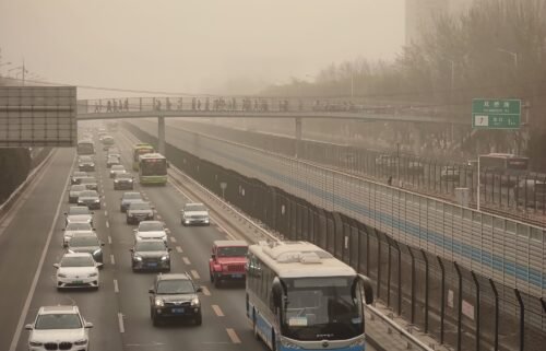 Cars drive in low-visibility through a sandstorm on March 22