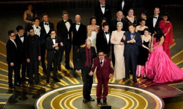 The cast and crew of "Everything Everywhere All at Once" accepts the award for best picture at the Oscars on March 12.