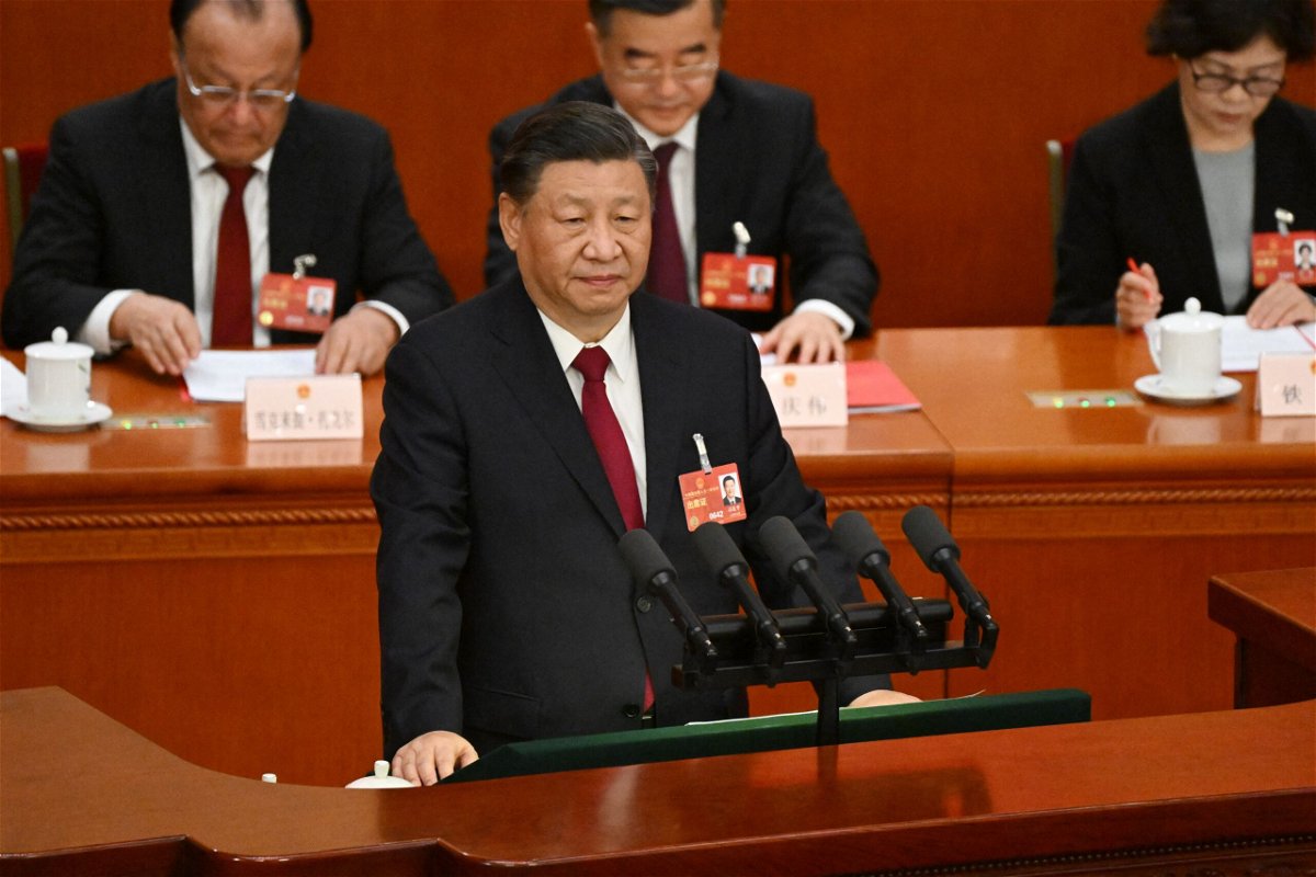 <i>Noel Celis/AFP/Getty Images</i><br/>Chinese leader Xi Jinping delivers the first speech of his third term as President at the closing of the National People's Congress in Beijing on March 13.
