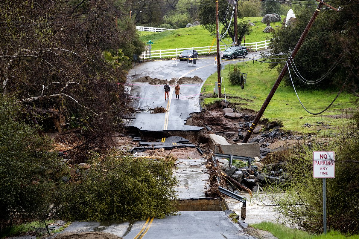 100,000 Californians still have no power as storms whip hurricane-force winds, flood homes and threaten 25 million people in other states