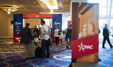 Attendees arrive ahead of the Conservative Political Action Conference (CPAC) in National Harbor