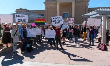 Dozens gather on March 21 at West Texas A&M University to protest the president's decision to cancel the student drag show.