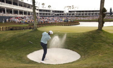 Scheffler plays a shot from a bunker on the 16th hole during the final round.