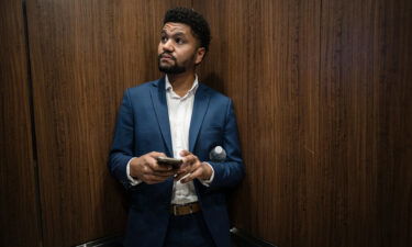 Maxwell Frost rides an elevator on his way to be interviewed on a podcast in Orlando