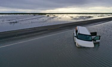 A vehicle submerges in flood waters in the Central Valley on March 22.