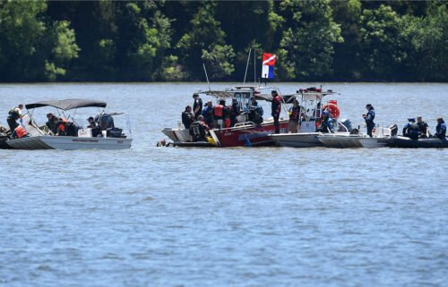 Emergency personnel remove debris from a plane crash in Percy Priest Lake on May 30