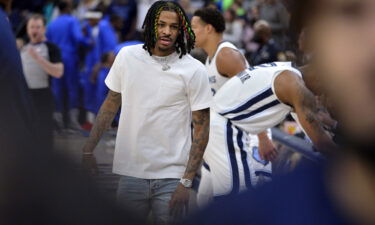 Ja Morant stands on the sideline before the Memphis Grizzlies' game against the Dallas Mavericks.