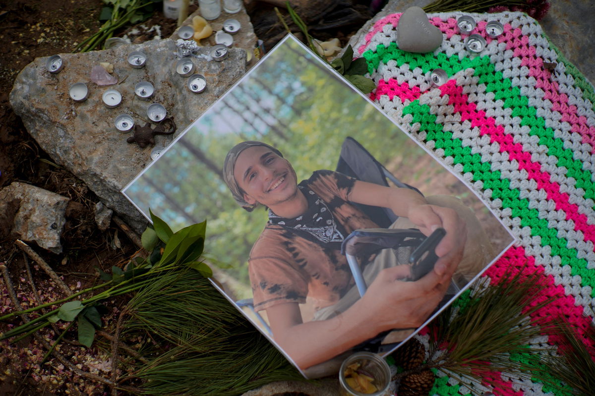 <i>Cheney Orr/Reuters</i><br/>A photograph of Manuel Terán is seen in January at a memorial site near Atlanta.