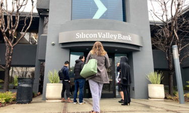 People stand outside of an entrance to Silicon Valley Bank in Santa Clara