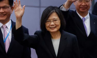 Taiwan's President Tsai Ing-wen waves near the boarding gate as she departs for a 10-day international trip on March 29.