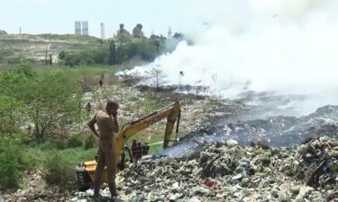 Firefighters work to put out a blaze at the Brahmapuram plant landfill in Kochi