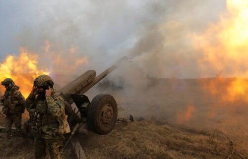 Ukrainian troops fire a D-30 howitzer at Russian positions near Bakhmut