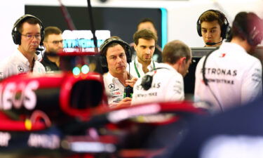 Wolff and George Russell look on in the garage during day two of F1 testing at Bahrain International Circuit on February 24.