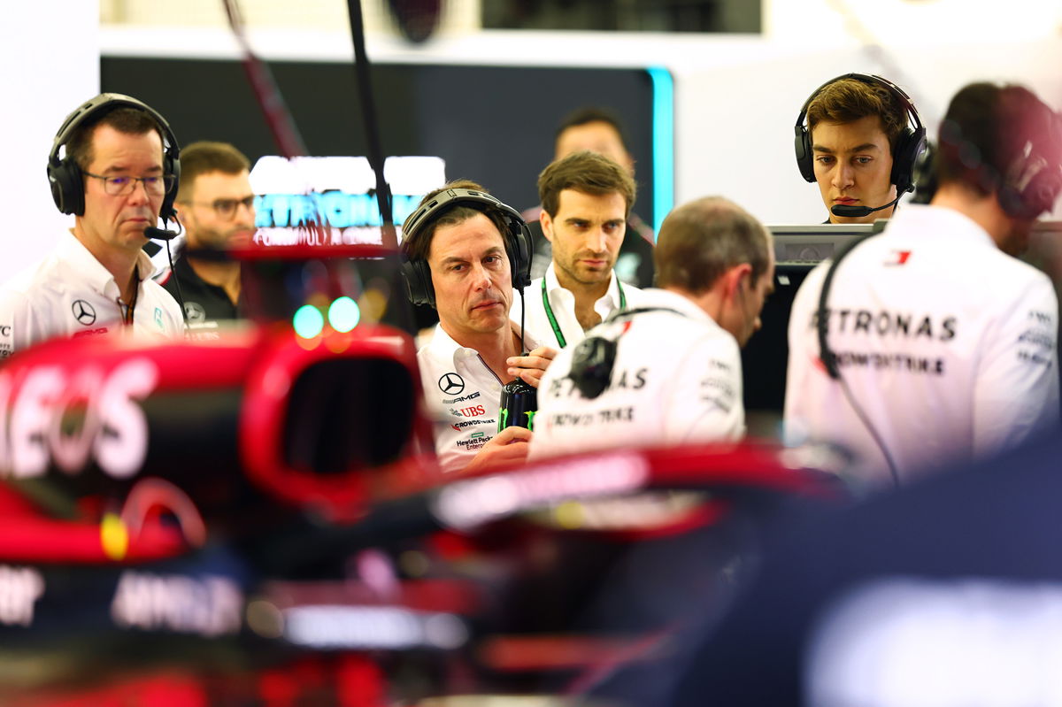 <i>Dan Istitene/Formula 1/Getty Images</i><br/>Wolff and George Russell look on in the garage during day two of F1 testing at Bahrain International Circuit on February 24.