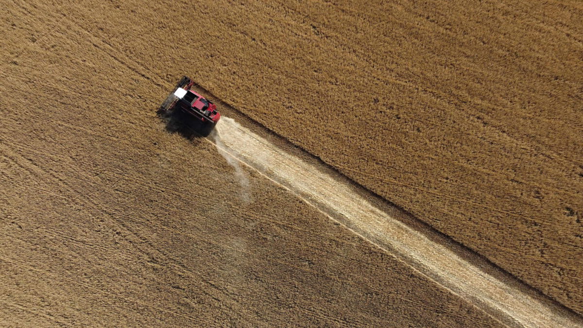 <i>Miguel Medina/AFP/Getty Images</i><br/>The US announces on Thursday new partnerships to boost Ukraine's agricultural sector and grain production. An aerial image from 2002 shows a farmer harvesting wheat in the Donetsk region in Ukraine.