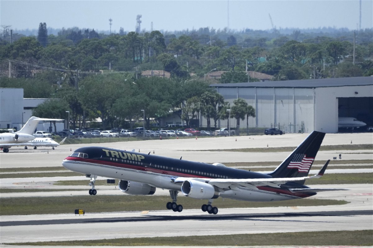 The plane carrying former president Donald Trump lifts off at Palm Beach International Airport, Monday, April 3, 2023, in West Palm Beach, Fla. Trump is heading to New York for his expected booking and arraignment on charges arising from hush money payments during his 2016 campaign.