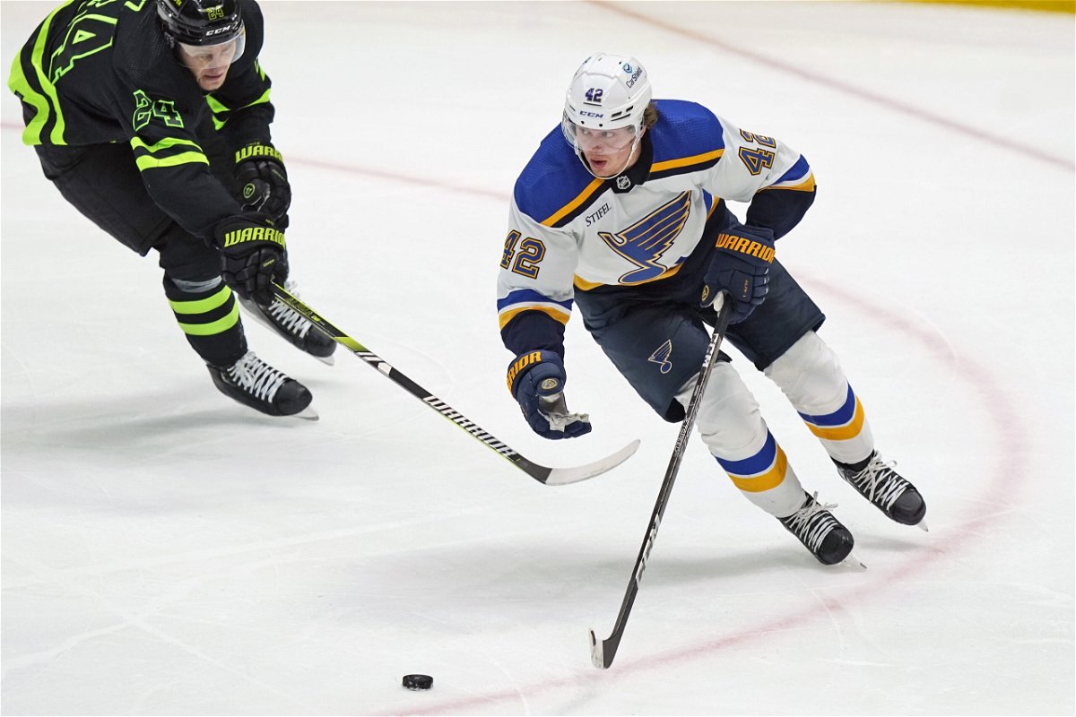 St. Louis Blues right wing Kasperi Kapanen (42) skates for the puck against Dallas Stars center Roope Hintz (24) during the second period of an NHL hockey game in Dallas, Thursday, April 13, 2023. (AP Photo/LM Otero)