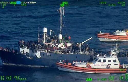Rescue operations are underway to retrieve hundreds of migrants adrift on a boat in the Mediterranean Sea