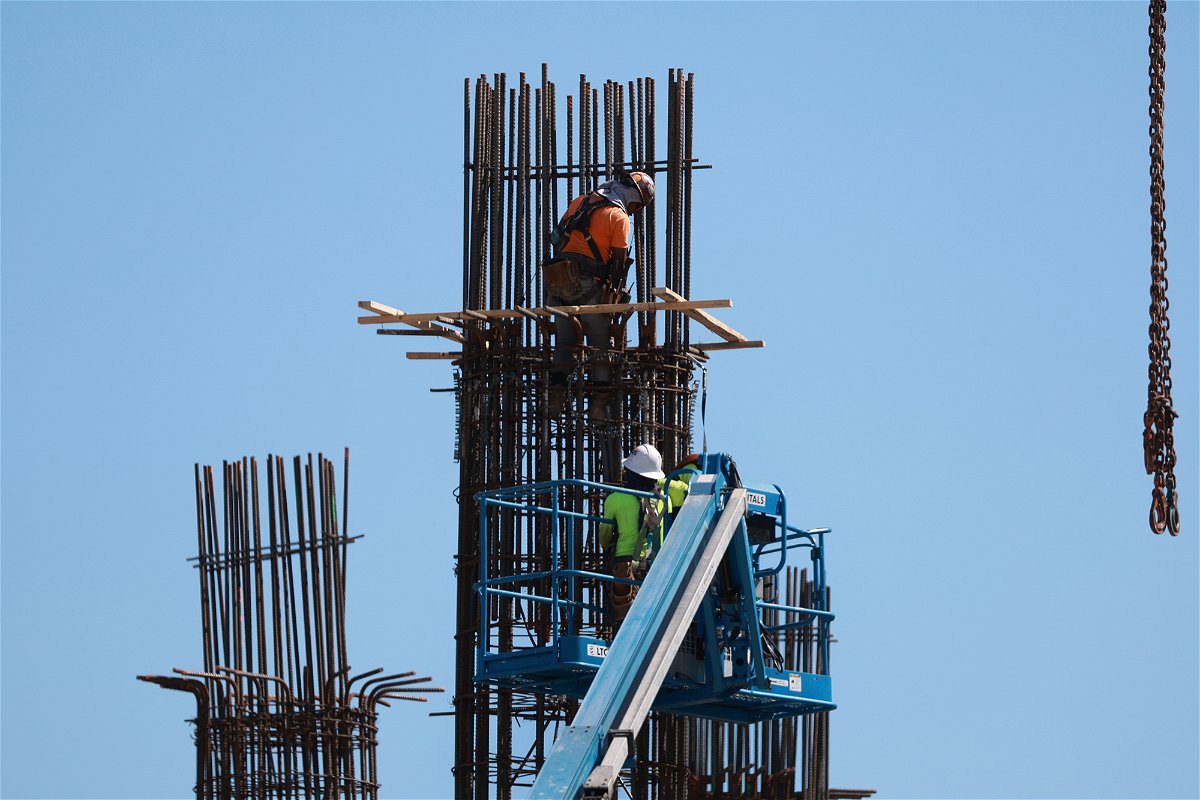 <i>Joe Raedle/Getty Images</i><br/>Construction workers are pictured here on a job site on March 10 in Miami