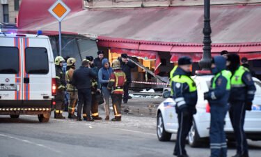 Russian police investigators inspect a damaged 'Street bar' cafe in a blast in St. Petersburg on April 2.