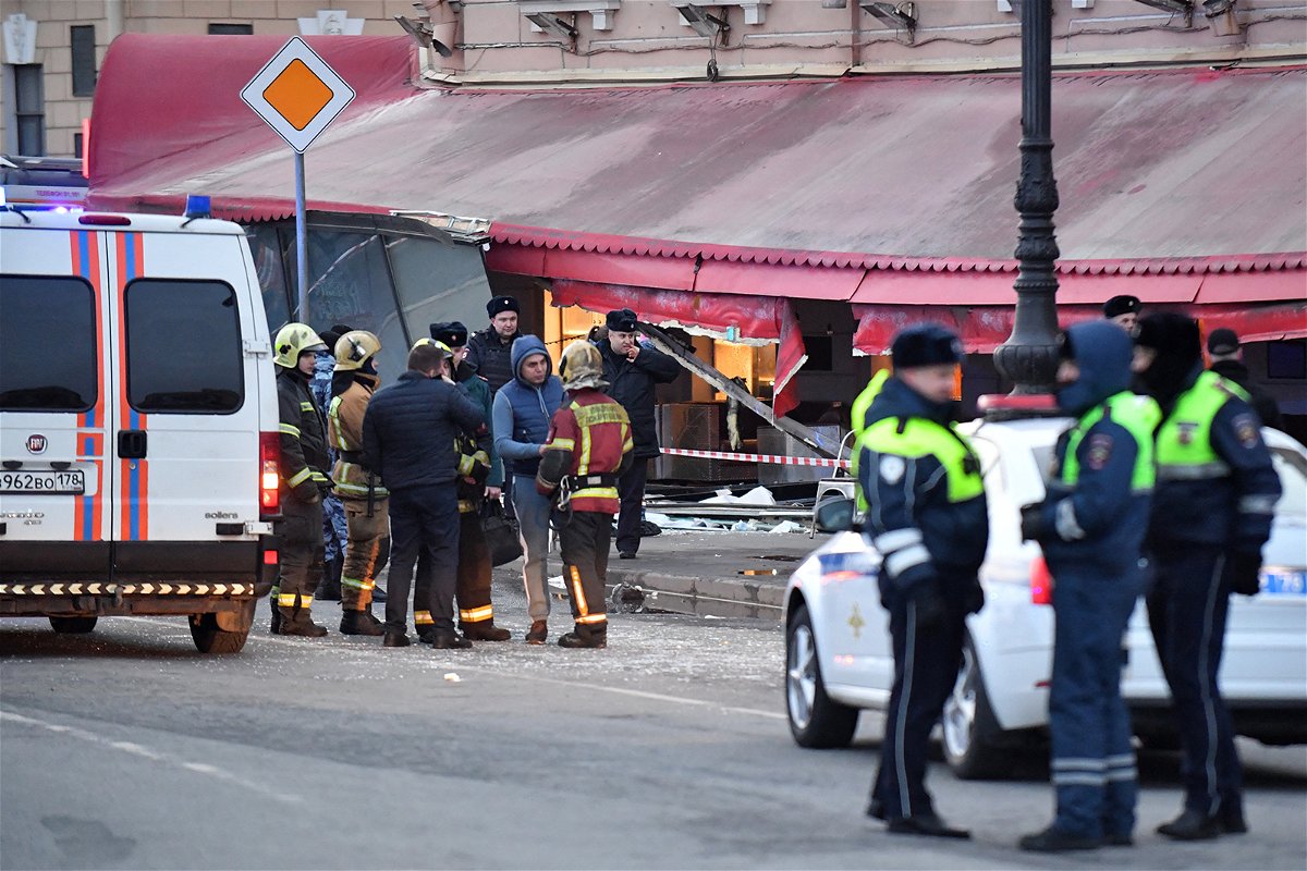 <i>Olga Maltseva/AFP/Getty Images</i><br/>Russian police investigators inspect a damaged 'Street bar' cafe in a blast in St. Petersburg on April 2.