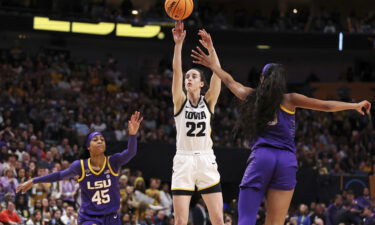 Clark shoots the ball against Reese during the fourth quarter of the championship game.