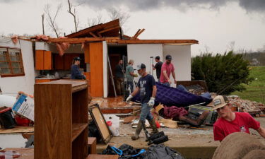 Friends and family salvage items from a home in Glenallen