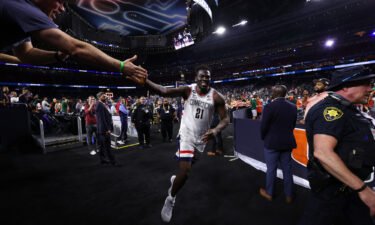 Adama Sanogo #21 of the Connecticut Huskies celebrates after defeating the Miami Hurricanes during the NCAA Men's Basketball Tournament Final Four semifinal game Saturday at NRG Stadium in Houston