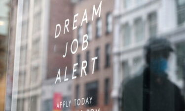 A 'help wanted' sign is displayed in a Manhattan store on May 6