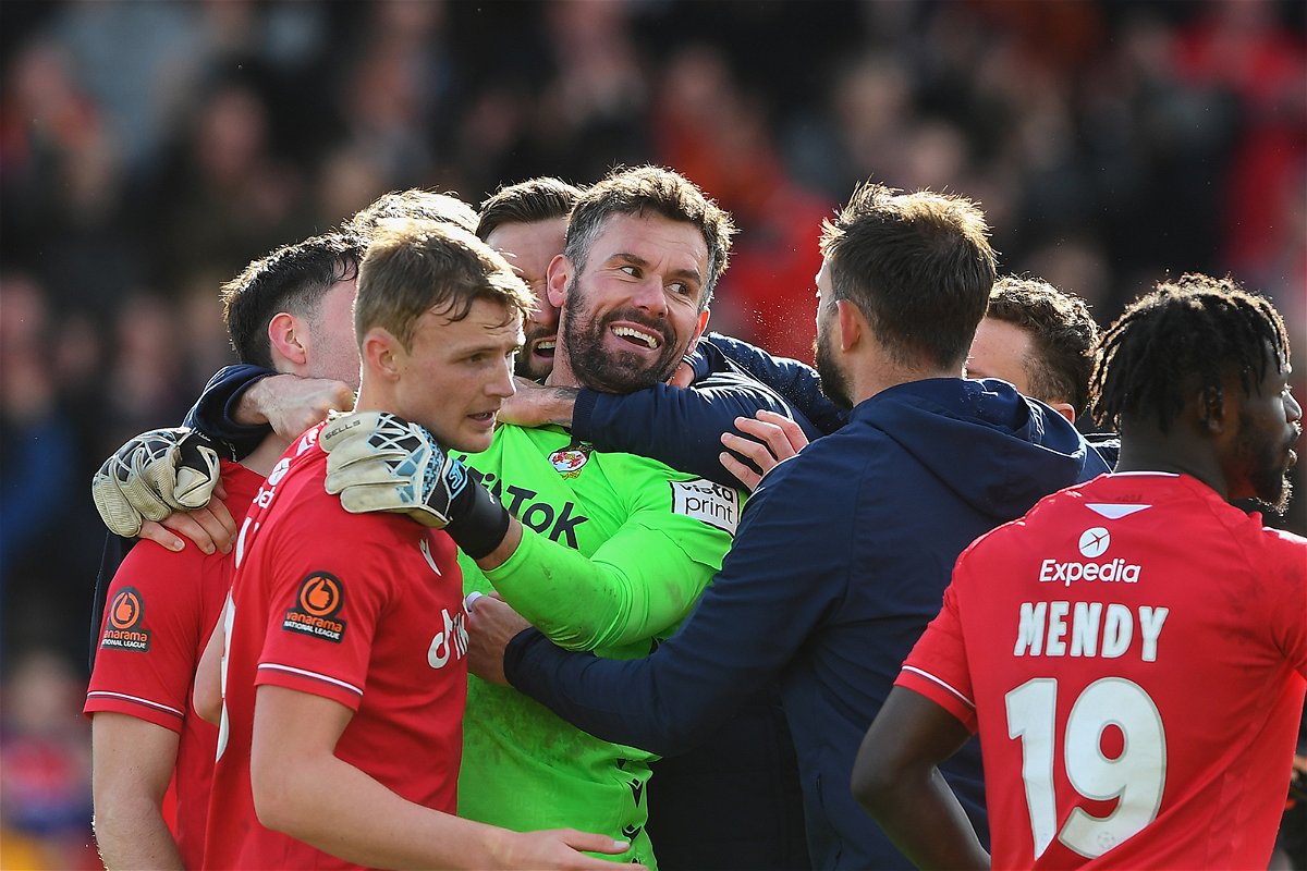 <i>Jon Hobley/MI News/NurPhoto/Getty Images</i><br/>Ben Foster celebrates with his teammates after his dramatic save.