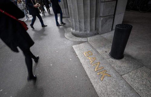 This photograph taken on March 20 shows the sign "Bank" at the entrance of the headquarters of Swiss giant banking UBS in Zurich.