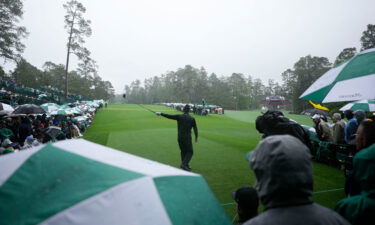 Woods points in the direction of his tee shot on the 14th hole during the third round.